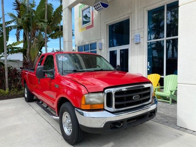 2001 Red /Medium Graphite Ford Super Duty F-250 7.3 TURBO DIESEL XL 1 OWNER (3FTNX20F31M) with an 7.3L DI V8 Turbo-Diesel Power Stroke Engine engine, Automatic transmission, located at 4701 North Dixie Hwy, Pompano Beach, FL, 33064, (954) 422-2889, 26.240938, -80.123474 - OUR WEBPAGE FLORIDACARS1.COM HAS OVER 100 PHOTOS AND FREE CARFAX LINK 2001 Ford F-250 Super Duty Lariat 1 OWNER 4 Door Extended Cab Pickup 7.3L V8 F Diesel Rear Wheel Drive Features ABS Brakes Air Conditioning Alloy Wheels AM/FM Stereo Automatic Transmission CD Audio Cruise Control Cloth Seats Overh- Photo#1