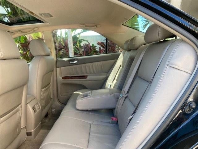 2005 Black /Taupe Toyota Camry XLE LOW MILES 76,231 1 OWNER (4T1BF32K25U) with an 3.0L DOHC MPFI Vvti 24-Valve V6 Engine engine, Automatic transmission, located at 4701 North Dixie Hwy, Pompano Beach, FL, 33064, (954) 422-2889, 26.240938, -80.123474 - OUR WEBPAGE FLORIDACARS1.COM HAS OVER 100 PHOTOS AND FREE CARFAX LINK 2005 Toyota Camry XLE V6 1 OWNER Sedan 4 DR 3.0L V6 F DOHC 24V Gasoline 28 MPG Front Wheel Drive Features ABS Brakes Air Conditioning Alloy Wheels AM/FM Stereo Automatic Transmission Cassette Player CD Audio Cruise Control JBL Sou- Photo#82