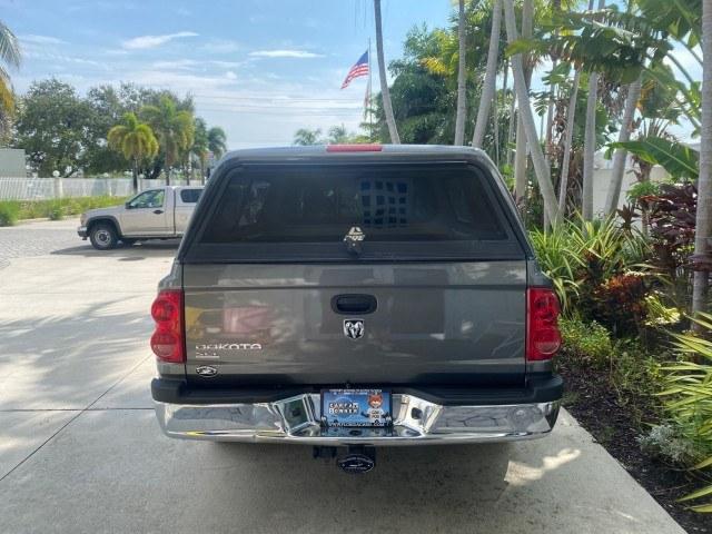 2005 Mineral Gray Metallic /Med Slate Gray Dodge Dakota SLT LOW MILES 70,362 4WD (1D7HW42K55S) with an 3.7L V6 Magnum Engine engine, Automatic transmission, located at 4701 North Dixie Hwy, Pompano Beach, FL, 33064, (954) 422-2889, 26.240938, -80.123474 - OUR WEBPAGE FLORIDACARS1.COM HAS OVER 100 PHOTOS AND FREE CARFAX LINK 2005 Dodge Dakota SLT Club Cab Pickup 3.7L V6 F Gasoline 20 MPG Rear Wheel Drive w/ 4X4 Features 4WD/AWD ABS Brakes Air Conditioning Alloy Wheels AM/FM Stereo Automatic Transmission Bed Cover Bed Liner CD Audio Cloth Seats Cruise- Photo#6