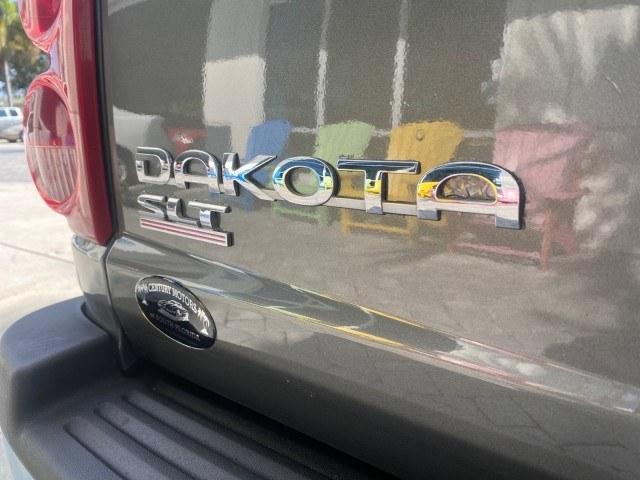 2005 Mineral Gray Metallic /Med Slate Gray Dodge Dakota SLT LOW MILES 70,362 4WD (1D7HW42K55S) with an 3.7L V6 Magnum Engine engine, Automatic transmission, located at 4701 North Dixie Hwy, Pompano Beach, FL, 33064, (954) 422-2889, 26.240938, -80.123474 - OUR WEBPAGE FLORIDACARS1.COM HAS OVER 100 PHOTOS AND FREE CARFAX LINK 2005 Dodge Dakota SLT Club Cab Pickup 3.7L V6 F Gasoline 20 MPG Rear Wheel Drive w/ 4X4 Features 4WD/AWD ABS Brakes Air Conditioning Alloy Wheels AM/FM Stereo Automatic Transmission Bed Cover Bed Liner CD Audio Cloth Seats Cruise- Photo#93