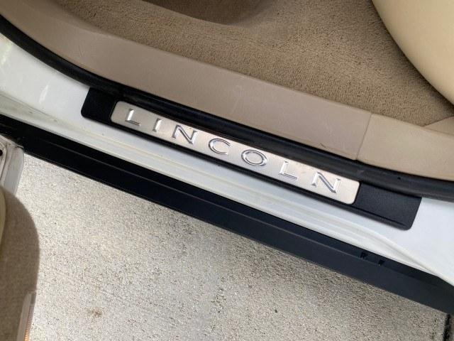 2010 Vibrant White /Light Camel Lincoln Town Car Signature Limited LOW MILES 47,515 (2LNBL8CV3AX) with an 4.6L SOHC EFI V8 FFV Engine engine, Automatic transmission, located at 4701 North Dixie Hwy, Pompano Beach, FL, 33064, (954) 422-2889, 26.240938, -80.123474 - OUR WEBPAGE FLORIDACARS1.COM HAS OVER 100 PHOTOS AND FREE CARFAX LINK 2010 Lincoln Town Car Signature Limited Sedan 4 DR 4.6L V8 F SOHC 16V Flex Fuel 24 MPG Rear Wheel Drive Features ABS Brakes Air Conditioning Alloy Wheels AM/FM Stereo Automatic Transmission CD Audio Cruise Control Flex Fuel Vehicl- Photo#77