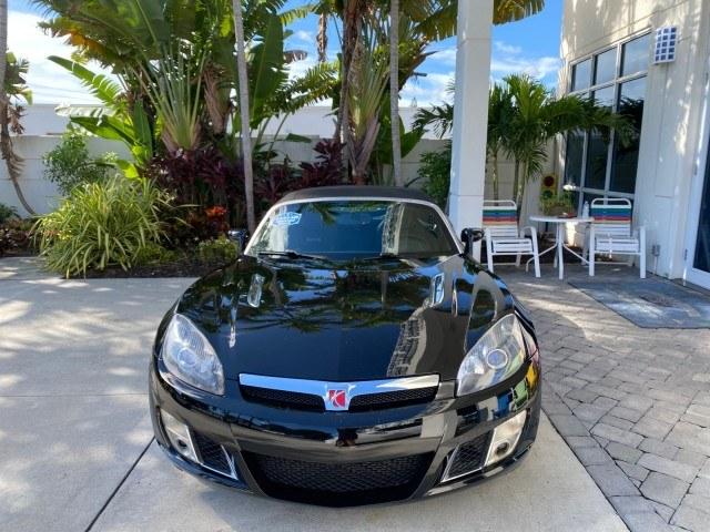 2009 Black Onyx /Black Saturn Sky Red Line TURBO LOW MILES 56,207 (1G8MT35X09Y) with an Turbocharged And Intercooled Ecotec 2.0L VVT DOHC 4-Cyl Aluminum Engine engine, Automatic transmission, located at 4701 North Dixie Hwy, Pompano Beach, FL, 33064, (954) 422-2889, 26.240938, -80.123474 - OUR WEBPAGE FLORIDACARS1.COM HAS OVER 100 PHOTOS AND FREE CARFAX LINK 2009 Saturn SKY Red Line Convertible 2.0L I4 F DOHC 16V Gasoline 31 MPG Rear Wheel Drive Features ABS Brakes Air Conditioning Alloy Wheels AM/FM Stereo Automatic Transmission CD Audio Leather Seats Cruise Control Power Locks Power- Photo#2