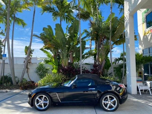 2009 Black Onyx /Black Saturn Sky Red Line TURBO LOW MILES 56,207 (1G8MT35X09Y) with an Turbocharged And Intercooled Ecotec 2.0L VVT DOHC 4-Cyl Aluminum Engine engine, Automatic transmission, located at 4701 North Dixie Hwy, Pompano Beach, FL, 33064, (954) 422-2889, 26.240938, -80.123474 - OUR WEBPAGE FLORIDACARS1.COM HAS OVER 100 PHOTOS AND FREE CARFAX LINK 2009 Saturn SKY Red Line Convertible 2.0L I4 F DOHC 16V Gasoline 31 MPG Rear Wheel Drive Features ABS Brakes Air Conditioning Alloy Wheels AM/FM Stereo Automatic Transmission CD Audio Leather Seats Cruise Control Power Locks Power- Photo#4