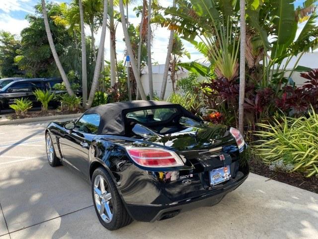 2009 Black Onyx /Black Saturn Sky Red Line TURBO LOW MILES 56,207 (1G8MT35X09Y) with an Turbocharged And Intercooled Ecotec 2.0L VVT DOHC 4-Cyl Aluminum Engine engine, Automatic transmission, located at 4701 North Dixie Hwy, Pompano Beach, FL, 33064, (954) 422-2889, 26.240938, -80.123474 - OUR WEBPAGE FLORIDACARS1.COM HAS OVER 100 PHOTOS AND FREE CARFAX LINK 2009 Saturn SKY Red Line Convertible 2.0L I4 F DOHC 16V Gasoline 31 MPG Rear Wheel Drive Features ABS Brakes Air Conditioning Alloy Wheels AM/FM Stereo Automatic Transmission CD Audio Leather Seats Cruise Control Power Locks Power- Photo#5