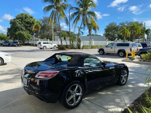 2009 Black Onyx /Black Saturn Sky Red Line TURBO LOW MILES 56,207 (1G8MT35X09Y) with an Turbocharged And Intercooled Ecotec 2.0L VVT DOHC 4-Cyl Aluminum Engine engine, Automatic transmission, located at 4701 North Dixie Hwy, Pompano Beach, FL, 33064, (954) 422-2889, 26.240938, -80.123474 - OUR WEBPAGE FLORIDACARS1.COM HAS OVER 100 PHOTOS AND FREE CARFAX LINK 2009 Saturn SKY Red Line Convertible 2.0L I4 F DOHC 16V Gasoline 31 MPG Rear Wheel Drive Features ABS Brakes Air Conditioning Alloy Wheels AM/FM Stereo Automatic Transmission CD Audio Leather Seats Cruise Control Power Locks Power- Photo#7