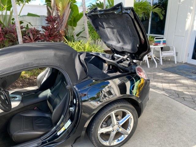 2009 Black Onyx /Black Saturn Sky Red Line TURBO LOW MILES 56,207 (1G8MT35X09Y) with an Turbocharged And Intercooled Ecotec 2.0L VVT DOHC 4-Cyl Aluminum Engine engine, Automatic transmission, located at 4701 North Dixie Hwy, Pompano Beach, FL, 33064, (954) 422-2889, 26.240938, -80.123474 - OUR WEBPAGE FLORIDACARS1.COM HAS OVER 100 PHOTOS AND FREE CARFAX LINK 2009 Saturn SKY Red Line Convertible 2.0L I4 F DOHC 16V Gasoline 31 MPG Rear Wheel Drive Features ABS Brakes Air Conditioning Alloy Wheels AM/FM Stereo Automatic Transmission CD Audio Leather Seats Cruise Control Power Locks Power- Photo#13
