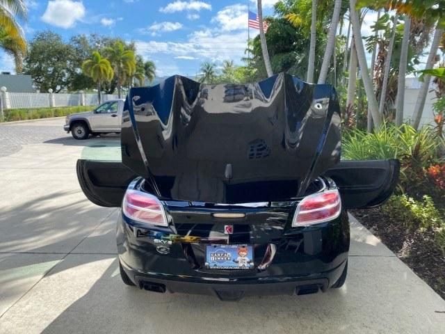 2009 Black Onyx /Black Saturn Sky Red Line TURBO LOW MILES 56,207 (1G8MT35X09Y) with an Turbocharged And Intercooled Ecotec 2.0L VVT DOHC 4-Cyl Aluminum Engine engine, Automatic transmission, located at 4701 North Dixie Hwy, Pompano Beach, FL, 33064, (954) 422-2889, 26.240938, -80.123474 - OUR WEBPAGE FLORIDACARS1.COM HAS OVER 100 PHOTOS AND FREE CARFAX LINK 2009 Saturn SKY Red Line Convertible 2.0L I4 F DOHC 16V Gasoline 31 MPG Rear Wheel Drive Features ABS Brakes Air Conditioning Alloy Wheels AM/FM Stereo Automatic Transmission CD Audio Leather Seats Cruise Control Power Locks Power- Photo#15