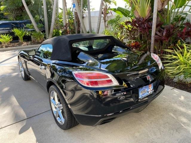 2009 Black Onyx /Black Saturn Sky Red Line TURBO LOW MILES 56,207 (1G8MT35X09Y) with an Turbocharged And Intercooled Ecotec 2.0L VVT DOHC 4-Cyl Aluminum Engine engine, Automatic transmission, located at 4701 North Dixie Hwy, Pompano Beach, FL, 33064, (954) 422-2889, 26.240938, -80.123474 - OUR WEBPAGE FLORIDACARS1.COM HAS OVER 100 PHOTOS AND FREE CARFAX LINK 2009 Saturn SKY Red Line Convertible 2.0L I4 F DOHC 16V Gasoline 31 MPG Rear Wheel Drive Features ABS Brakes Air Conditioning Alloy Wheels AM/FM Stereo Automatic Transmission CD Audio Leather Seats Cruise Control Power Locks Power- Photo#40