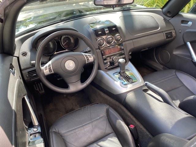 2009 Black Onyx /Black Saturn Sky Red Line TURBO LOW MILES 56,207 (1G8MT35X09Y) with an Turbocharged And Intercooled Ecotec 2.0L VVT DOHC 4-Cyl Aluminum Engine engine, Automatic transmission, located at 4701 North Dixie Hwy, Pompano Beach, FL, 33064, (954) 422-2889, 26.240938, -80.123474 - OUR WEBPAGE FLORIDACARS1.COM HAS OVER 100 PHOTOS AND FREE CARFAX LINK 2009 Saturn SKY Red Line Convertible 2.0L I4 F DOHC 16V Gasoline 31 MPG Rear Wheel Drive Features ABS Brakes Air Conditioning Alloy Wheels AM/FM Stereo Automatic Transmission CD Audio Leather Seats Cruise Control Power Locks Power- Photo#47