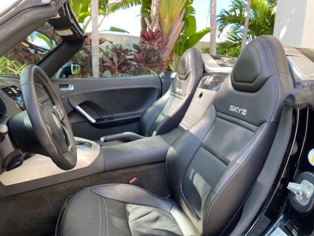 2009 Black Onyx /Black Saturn Sky Red Line TURBO LOW MILES 56,207 (1G8MT35X09Y) with an Turbocharged And Intercooled Ecotec 2.0L VVT DOHC 4-Cyl Aluminum Engine engine, Automatic transmission, located at 4701 North Dixie Hwy, Pompano Beach, FL, 33064, (954) 422-2889, 26.240938, -80.123474 - OUR WEBPAGE FLORIDACARS1.COM HAS OVER 100 PHOTOS AND FREE CARFAX LINK 2009 Saturn SKY Red Line Convertible 2.0L I4 F DOHC 16V Gasoline 31 MPG Rear Wheel Drive Features ABS Brakes Air Conditioning Alloy Wheels AM/FM Stereo Automatic Transmission CD Audio Leather Seats Cruise Control Power Locks Power- Photo#62