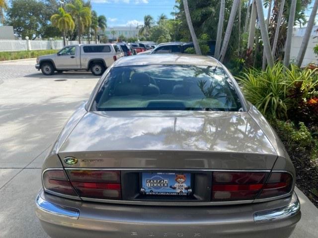 2000 Light Bronzemist Metallic /Taupe Buick Park Avenue Ultra LOW MILES 72,419 (1G4CU5416Y4) with an 3.8L SFI V6 3800 Series II Supercharged Engine engine, Automatic transmission, located at 4701 North Dixie Hwy, Pompano Beach, FL, 33064, (954) 422-2889, 26.240938, -80.123474 - OUR WEBPAGE FLORIDACARS1.COM HAS OVER 100 PHOTOS AND FREE CARFAX LINK 2000 Buick Park Avenue Ultra Sedan 4 DR 3.8L V6 F Gasoline 27 MPG Front Wheel Drive Features ABS Brakes Air Conditioning Alloy Wheels AM/FM Stereo Automatic Transmission Cassette Player CD Audio Cruise Control Front Seat Heaters L- Photo#99