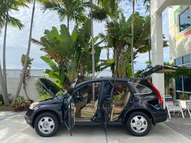 2007 Nighthawk Black Pearl /Ivory Honda CR-V LX LOW MILES 74,639 (JHLRE38377C) with an 2.4L 4-Cyl Engine engine, Automatic transmission, located at 4701 North Dixie Hwy, Pompano Beach, FL, 33064, (954) 422-2889, 26.240938, -80.123474 - OUR WEBPAGE FLORIDACARS1.COM HAS OVER 100 PHOTOS AND FREE CARFAX LINK 2007 Honda CR-V LX 4 Door Wagon/Sport Utility 2.4L I4 F DOHC 16V Gasoline 30 MPG Front Wheel Drive Features ABS Brakes Air Conditioning AM/FM Stereo Automatic Transmission Auxiliary Audio Input CD Audio Cloth Seats Cruise Control- Photo#8