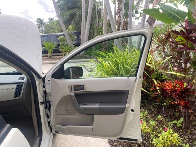 2011 White Suede /Medium Stone Ford Focus SE LOW MILES 36,864 (1FAHP3FN6BW) with an 2.0L 4-Cyl Engine engine, Automatic transmission, located at 4701 North Dixie Hwy, Pompano Beach, FL, 33064, (954) 422-2889, 26.240938, -80.123474 - OUR WEBPAGE FLORIDACARS1.COM HAS OVER 100 PHOTOS AND FREE CARFAX LINK 2011 Ford Focus SE Sedan 4 DR 2.0L I4 F DOHC 16V Gasoline 35 MPG Front Wheel Drive Features ABS Brakes Air Conditioning Alloy Wheels AM/FM Stereo Automatic Transmission Auxiliary Audio Input CD Audio Cloth Seats Cruise Control Ove- Photo#11