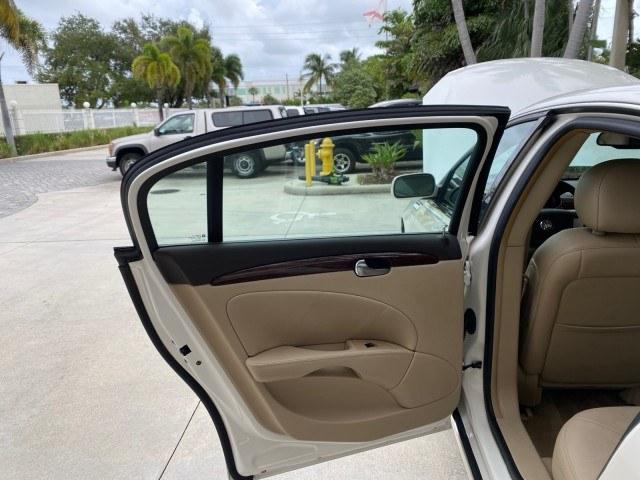 2011 White Diamond Tricoat /Cocoa/Cashmere Buick Lucerne CXL LOW MILES 39,527 (1G4HC5EM2BU) with an 3.9L V6 SFI Flex-Fuel Engine engine, Automatic transmission, located at 4701 North Dixie Hwy, Pompano Beach, FL, 33064, (954) 422-2889, 26.240938, -80.123474 - OUR WEBPAGE FLORIDACARS1.COM HAS OVER 100 PHOTOS AND FREE CARFAX LINK 2011 Buick Lucerne CXL Sedan 4 DR 3.9L V6 F OHV 12V Flex Fuel 27 MPG Front Wheel Drive Features ABS Brakes Air Conditioning Alloy Wheels AM/FM Stereo Automatic Transmission Auxiliary Audio Input Blind Spot Monitor Bluetooth Techno- Photo#13