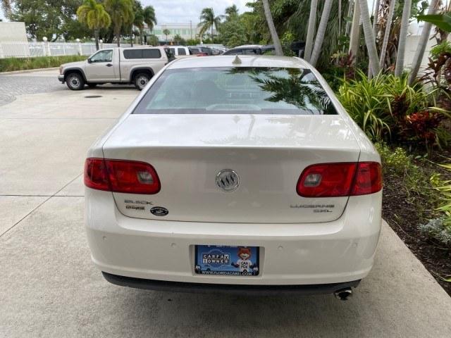 2011 White Diamond Tricoat /Cocoa/Cashmere Buick Lucerne CXL LOW MILES 39,527 (1G4HC5EM2BU) with an 3.9L V6 SFI Flex-Fuel Engine engine, Automatic transmission, located at 4701 North Dixie Hwy, Pompano Beach, FL, 33064, (954) 422-2889, 26.240938, -80.123474 - OUR WEBPAGE FLORIDACARS1.COM HAS OVER 100 PHOTOS AND FREE CARFAX LINK 2011 Buick Lucerne CXL Sedan 4 DR 3.9L V6 F OHV 12V Flex Fuel 27 MPG Front Wheel Drive Features ABS Brakes Air Conditioning Alloy Wheels AM/FM Stereo Automatic Transmission Auxiliary Audio Input Blind Spot Monitor Bluetooth Techno- Photo#65
