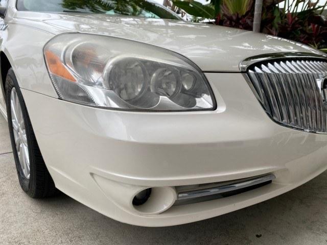 2011 White Diamond Tricoat /Cocoa/Cashmere Buick Lucerne CXL LOW MILES 39,527 (1G4HC5EM2BU) with an 3.9L V6 SFI Flex-Fuel Engine engine, Automatic transmission, located at 4701 North Dixie Hwy, Pompano Beach, FL, 33064, (954) 422-2889, 26.240938, -80.123474 - OUR WEBPAGE FLORIDACARS1.COM HAS OVER 100 PHOTOS AND FREE CARFAX LINK 2011 Buick Lucerne CXL Sedan 4 DR 3.9L V6 F OHV 12V Flex Fuel 27 MPG Front Wheel Drive Features ABS Brakes Air Conditioning Alloy Wheels AM/FM Stereo Automatic Transmission Auxiliary Audio Input Blind Spot Monitor Bluetooth Techno- Photo#90