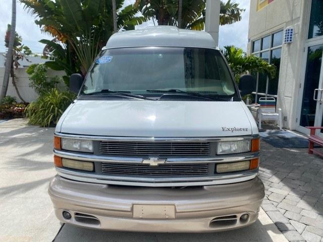 2002 Summit White /Neutral Chevrolet Express Van HI TOP EXPLORER CONV (1GBFG15R321) with an 5.7L Vortec 5700 SFI V8 Gas Engine engine, Automatic transmission, located at 4701 North Dixie Hwy, Pompano Beach, FL, 33064, (954) 422-2889, 26.240938, -80.123474 - OUR WEBPAGE FLORIDACARS1.COM HAS OVER 100 PHOTOS AND FREE CARFAX LINK 2002 Chevrolet Express G1500 Van 5.7L V8 F OHV Gasoline 17 MPG Rear Wheel Drive Features ABS Brakes Air Conditioning AM/FM Stereo Automatic Transmission Cassette Player CD Audio Power Locks Power Mirrors Power Seat(s) Power Window- Photo#2