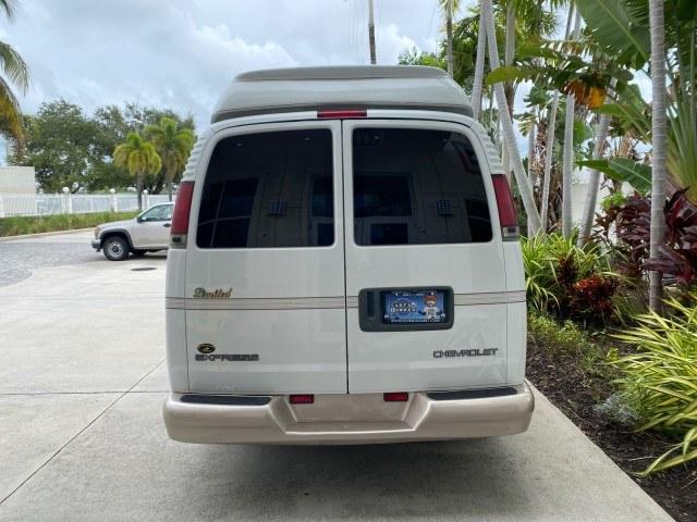 2002 Summit White /Neutral Chevrolet Express Van HI TOP EXPLORER CONV (1GBFG15R321) with an 5.7L Vortec 5700 SFI V8 Gas Engine engine, Automatic transmission, located at 4701 North Dixie Hwy, Pompano Beach, FL, 33064, (954) 422-2889, 26.240938, -80.123474 - OUR WEBPAGE FLORIDACARS1.COM HAS OVER 100 PHOTOS AND FREE CARFAX LINK 2002 Chevrolet Express G1500 Van 5.7L V8 F OHV Gasoline 17 MPG Rear Wheel Drive Features ABS Brakes Air Conditioning AM/FM Stereo Automatic Transmission Cassette Player CD Audio Power Locks Power Mirrors Power Seat(s) Power Window- Photo#6