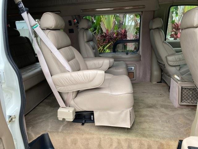 2002 Summit White /Neutral Chevrolet Express Van HI TOP EXPLORER CONV (1GBFG15R321) with an 5.7L Vortec 5700 SFI V8 Gas Engine engine, Automatic transmission, located at 4701 North Dixie Hwy, Pompano Beach, FL, 33064, (954) 422-2889, 26.240938, -80.123474 - OUR WEBPAGE FLORIDACARS1.COM HAS OVER 100 PHOTOS AND FREE CARFAX LINK 2002 Chevrolet Express G1500 Van 5.7L V8 F OHV Gasoline 17 MPG Rear Wheel Drive Features ABS Brakes Air Conditioning AM/FM Stereo Automatic Transmission Cassette Player CD Audio Power Locks Power Mirrors Power Seat(s) Power Window- Photo#14