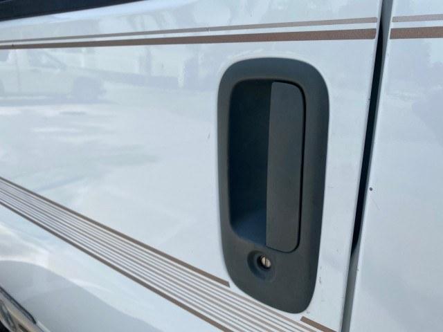2002 Summit White /Neutral Chevrolet Express Van HI TOP EXPLORER CONV (1GBFG15R321) with an 5.7L Vortec 5700 SFI V8 Gas Engine engine, Automatic transmission, located at 4701 North Dixie Hwy, Pompano Beach, FL, 33064, (954) 422-2889, 26.240938, -80.123474 - OUR WEBPAGE FLORIDACARS1.COM HAS OVER 100 PHOTOS AND FREE CARFAX LINK 2002 Chevrolet Express G1500 Van 5.7L V8 F OHV Gasoline 17 MPG Rear Wheel Drive Features ABS Brakes Air Conditioning AM/FM Stereo Automatic Transmission Cassette Player CD Audio Power Locks Power Mirrors Power Seat(s) Power Window- Photo#27