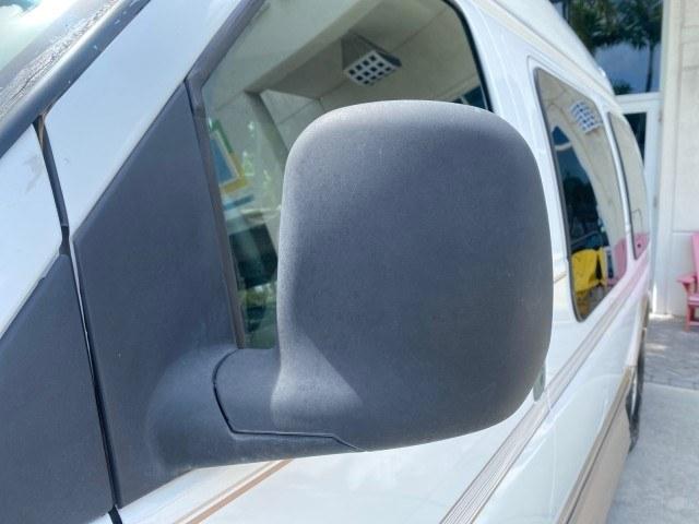 2002 Summit White /Neutral Chevrolet Express Van HI TOP EXPLORER CONV (1GBFG15R321) with an 5.7L Vortec 5700 SFI V8 Gas Engine engine, Automatic transmission, located at 4701 North Dixie Hwy, Pompano Beach, FL, 33064, (954) 422-2889, 26.240938, -80.123474 - OUR WEBPAGE FLORIDACARS1.COM HAS OVER 100 PHOTOS AND FREE CARFAX LINK 2002 Chevrolet Express G1500 Van 5.7L V8 F OHV Gasoline 17 MPG Rear Wheel Drive Features ABS Brakes Air Conditioning AM/FM Stereo Automatic Transmission Cassette Player CD Audio Power Locks Power Mirrors Power Seat(s) Power Window- Photo#29