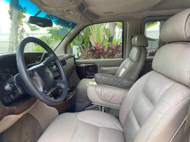 2002 Summit White /Neutral Chevrolet Express Van HI TOP EXPLORER CONV (1GBFG15R321) with an 5.7L Vortec 5700 SFI V8 Gas Engine engine, Automatic transmission, located at 4701 North Dixie Hwy, Pompano Beach, FL, 33064, (954) 422-2889, 26.240938, -80.123474 - OUR WEBPAGE FLORIDACARS1.COM HAS OVER 100 PHOTOS AND FREE CARFAX LINK 2002 Chevrolet Express G1500 Van 5.7L V8 F OHV Gasoline 17 MPG Rear Wheel Drive Features ABS Brakes Air Conditioning AM/FM Stereo Automatic Transmission Cassette Player CD Audio Power Locks Power Mirrors Power Seat(s) Power Window- Photo#34
