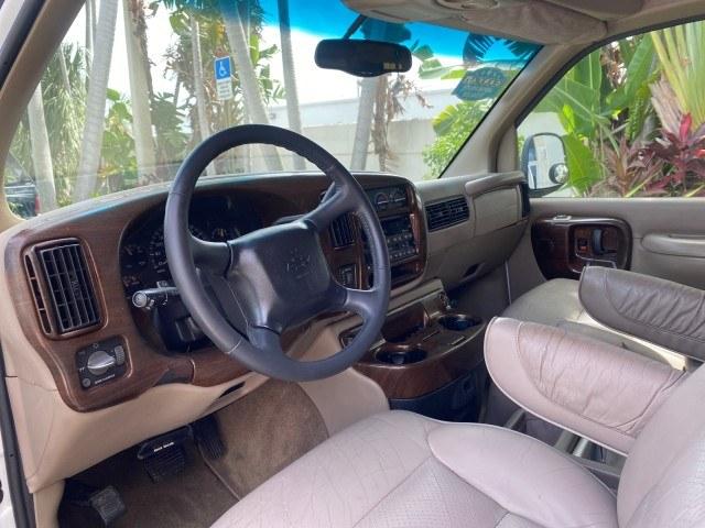2002 Summit White /Neutral Chevrolet Express Van HI TOP EXPLORER CONV (1GBFG15R321) with an 5.7L Vortec 5700 SFI V8 Gas Engine engine, Automatic transmission, located at 4701 North Dixie Hwy, Pompano Beach, FL, 33064, (954) 422-2889, 26.240938, -80.123474 - OUR WEBPAGE FLORIDACARS1.COM HAS OVER 100 PHOTOS AND FREE CARFAX LINK 2002 Chevrolet Express G1500 Van 5.7L V8 F OHV Gasoline 17 MPG Rear Wheel Drive Features ABS Brakes Air Conditioning AM/FM Stereo Automatic Transmission Cassette Player CD Audio Power Locks Power Mirrors Power Seat(s) Power Window- Photo#35