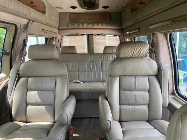2002 Summit White /Neutral Chevrolet Express Van HI TOP EXPLORER CONV (1GBFG15R321) with an 5.7L Vortec 5700 SFI V8 Gas Engine engine, Automatic transmission, located at 4701 North Dixie Hwy, Pompano Beach, FL, 33064, (954) 422-2889, 26.240938, -80.123474 - OUR WEBPAGE FLORIDACARS1.COM HAS OVER 100 PHOTOS AND FREE CARFAX LINK 2002 Chevrolet Express G1500 Van 5.7L V8 F OHV Gasoline 17 MPG Rear Wheel Drive Features ABS Brakes Air Conditioning AM/FM Stereo Automatic Transmission Cassette Player CD Audio Power Locks Power Mirrors Power Seat(s) Power Window- Photo#49