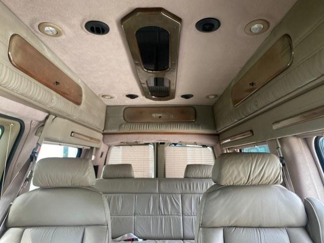 2002 Summit White /Neutral Chevrolet Express Van HI TOP EXPLORER CONV (1GBFG15R321) with an 5.7L Vortec 5700 SFI V8 Gas Engine engine, Automatic transmission, located at 4701 North Dixie Hwy, Pompano Beach, FL, 33064, (954) 422-2889, 26.240938, -80.123474 - OUR WEBPAGE FLORIDACARS1.COM HAS OVER 100 PHOTOS AND FREE CARFAX LINK 2002 Chevrolet Express G1500 Van 5.7L V8 F OHV Gasoline 17 MPG Rear Wheel Drive Features ABS Brakes Air Conditioning AM/FM Stereo Automatic Transmission Cassette Player CD Audio Power Locks Power Mirrors Power Seat(s) Power Window- Photo#50