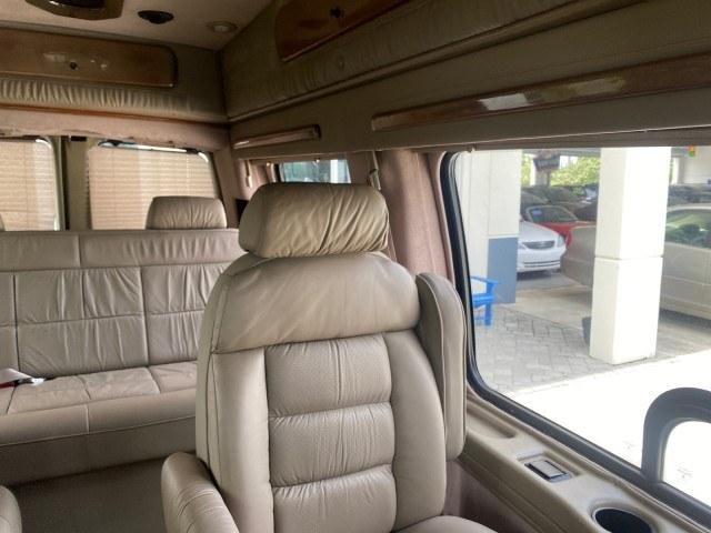 2002 Summit White /Neutral Chevrolet Express Van HI TOP EXPLORER CONV (1GBFG15R321) with an 5.7L Vortec 5700 SFI V8 Gas Engine engine, Automatic transmission, located at 4701 North Dixie Hwy, Pompano Beach, FL, 33064, (954) 422-2889, 26.240938, -80.123474 - OUR WEBPAGE FLORIDACARS1.COM HAS OVER 100 PHOTOS AND FREE CARFAX LINK 2002 Chevrolet Express G1500 Van 5.7L V8 F OHV Gasoline 17 MPG Rear Wheel Drive Features ABS Brakes Air Conditioning AM/FM Stereo Automatic Transmission Cassette Player CD Audio Power Locks Power Mirrors Power Seat(s) Power Window- Photo#51