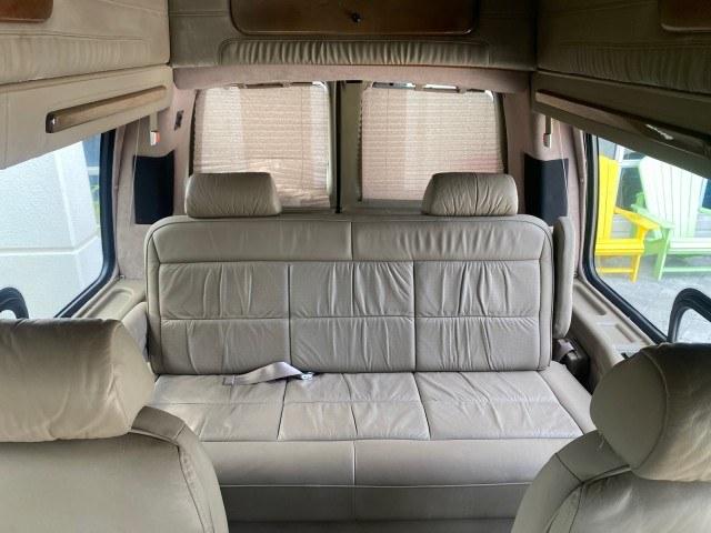 2002 Summit White /Neutral Chevrolet Express Van HI TOP EXPLORER CONV (1GBFG15R321) with an 5.7L Vortec 5700 SFI V8 Gas Engine engine, Automatic transmission, located at 4701 North Dixie Hwy, Pompano Beach, FL, 33064, (954) 422-2889, 26.240938, -80.123474 - OUR WEBPAGE FLORIDACARS1.COM HAS OVER 100 PHOTOS AND FREE CARFAX LINK 2002 Chevrolet Express G1500 Van 5.7L V8 F OHV Gasoline 17 MPG Rear Wheel Drive Features ABS Brakes Air Conditioning AM/FM Stereo Automatic Transmission Cassette Player CD Audio Power Locks Power Mirrors Power Seat(s) Power Window- Photo#52