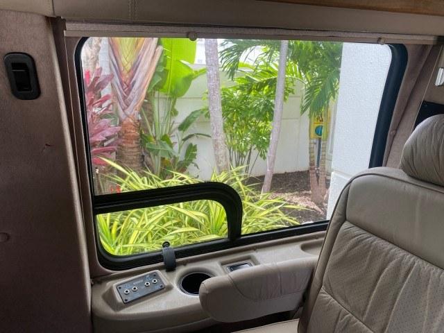 2002 Summit White /Neutral Chevrolet Express Van HI TOP EXPLORER CONV (1GBFG15R321) with an 5.7L Vortec 5700 SFI V8 Gas Engine engine, Automatic transmission, located at 4701 North Dixie Hwy, Pompano Beach, FL, 33064, (954) 422-2889, 26.240938, -80.123474 - OUR WEBPAGE FLORIDACARS1.COM HAS OVER 100 PHOTOS AND FREE CARFAX LINK 2002 Chevrolet Express G1500 Van 5.7L V8 F OHV Gasoline 17 MPG Rear Wheel Drive Features ABS Brakes Air Conditioning AM/FM Stereo Automatic Transmission Cassette Player CD Audio Power Locks Power Mirrors Power Seat(s) Power Window- Photo#53