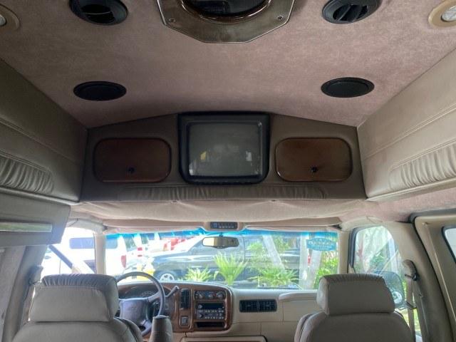 2002 Summit White /Neutral Chevrolet Express Van HI TOP EXPLORER CONV (1GBFG15R321) with an 5.7L Vortec 5700 SFI V8 Gas Engine engine, Automatic transmission, located at 4701 North Dixie Hwy, Pompano Beach, FL, 33064, (954) 422-2889, 26.240938, -80.123474 - OUR WEBPAGE FLORIDACARS1.COM HAS OVER 100 PHOTOS AND FREE CARFAX LINK 2002 Chevrolet Express G1500 Van 5.7L V8 F OHV Gasoline 17 MPG Rear Wheel Drive Features ABS Brakes Air Conditioning AM/FM Stereo Automatic Transmission Cassette Player CD Audio Power Locks Power Mirrors Power Seat(s) Power Window- Photo#55
