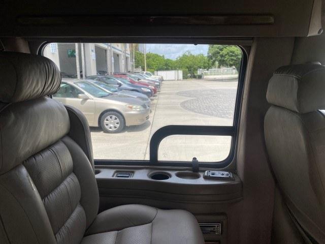 2002 Summit White /Neutral Chevrolet Express Van HI TOP EXPLORER CONV (1GBFG15R321) with an 5.7L Vortec 5700 SFI V8 Gas Engine engine, Automatic transmission, located at 4701 North Dixie Hwy, Pompano Beach, FL, 33064, (954) 422-2889, 26.240938, -80.123474 - OUR WEBPAGE FLORIDACARS1.COM HAS OVER 100 PHOTOS AND FREE CARFAX LINK 2002 Chevrolet Express G1500 Van 5.7L V8 F OHV Gasoline 17 MPG Rear Wheel Drive Features ABS Brakes Air Conditioning AM/FM Stereo Automatic Transmission Cassette Player CD Audio Power Locks Power Mirrors Power Seat(s) Power Window- Photo#63