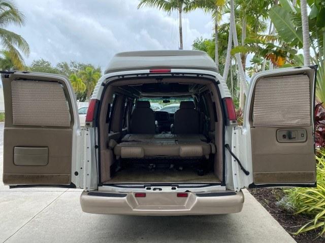 2002 Summit White /Neutral Chevrolet Express Van HI TOP EXPLORER CONV (1GBFG15R321) with an 5.7L Vortec 5700 SFI V8 Gas Engine engine, Automatic transmission, located at 4701 North Dixie Hwy, Pompano Beach, FL, 33064, (954) 422-2889, 26.240938, -80.123474 - OUR WEBPAGE FLORIDACARS1.COM HAS OVER 100 PHOTOS AND FREE CARFAX LINK 2002 Chevrolet Express G1500 Van 5.7L V8 F OHV Gasoline 17 MPG Rear Wheel Drive Features ABS Brakes Air Conditioning AM/FM Stereo Automatic Transmission Cassette Player CD Audio Power Locks Power Mirrors Power Seat(s) Power Window- Photo#73