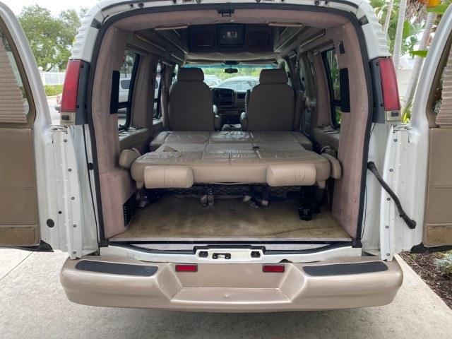 2002 Summit White /Neutral Chevrolet Express Van HI TOP EXPLORER CONV (1GBFG15R321) with an 5.7L Vortec 5700 SFI V8 Gas Engine engine, Automatic transmission, located at 4701 North Dixie Hwy, Pompano Beach, FL, 33064, (954) 422-2889, 26.240938, -80.123474 - OUR WEBPAGE FLORIDACARS1.COM HAS OVER 100 PHOTOS AND FREE CARFAX LINK 2002 Chevrolet Express G1500 Van 5.7L V8 F OHV Gasoline 17 MPG Rear Wheel Drive Features ABS Brakes Air Conditioning AM/FM Stereo Automatic Transmission Cassette Player CD Audio Power Locks Power Mirrors Power Seat(s) Power Window- Photo#74