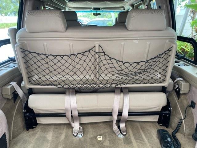 2002 Summit White /Neutral Chevrolet Express Van HI TOP EXPLORER CONV (1GBFG15R321) with an 5.7L Vortec 5700 SFI V8 Gas Engine engine, Automatic transmission, located at 4701 North Dixie Hwy, Pompano Beach, FL, 33064, (954) 422-2889, 26.240938, -80.123474 - OUR WEBPAGE FLORIDACARS1.COM HAS OVER 100 PHOTOS AND FREE CARFAX LINK 2002 Chevrolet Express G1500 Van 5.7L V8 F OHV Gasoline 17 MPG Rear Wheel Drive Features ABS Brakes Air Conditioning AM/FM Stereo Automatic Transmission Cassette Player CD Audio Power Locks Power Mirrors Power Seat(s) Power Window- Photo#79
