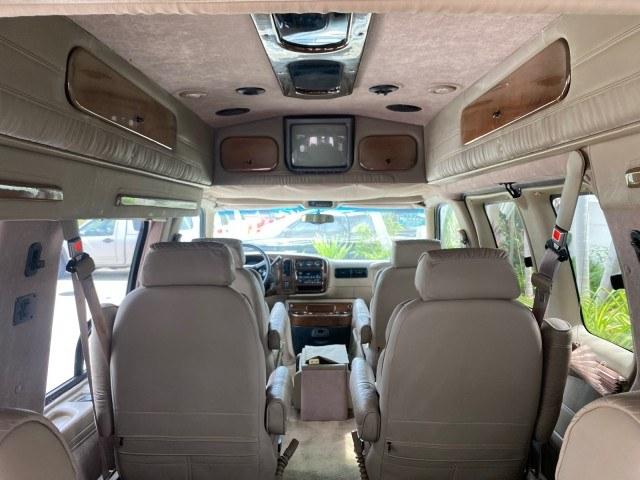 2002 Summit White /Neutral Chevrolet Express Van HI TOP EXPLORER CONV (1GBFG15R321) with an 5.7L Vortec 5700 SFI V8 Gas Engine engine, Automatic transmission, located at 4701 North Dixie Hwy, Pompano Beach, FL, 33064, (954) 422-2889, 26.240938, -80.123474 - OUR WEBPAGE FLORIDACARS1.COM HAS OVER 100 PHOTOS AND FREE CARFAX LINK 2002 Chevrolet Express G1500 Van 5.7L V8 F OHV Gasoline 17 MPG Rear Wheel Drive Features ABS Brakes Air Conditioning AM/FM Stereo Automatic Transmission Cassette Player CD Audio Power Locks Power Mirrors Power Seat(s) Power Window- Photo#82