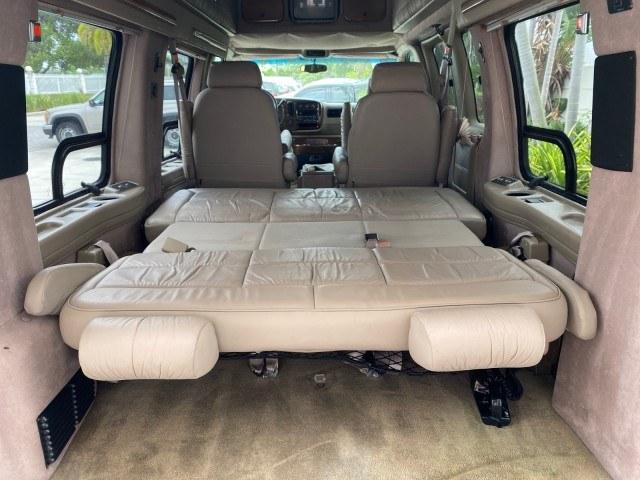 2002 Summit White /Neutral Chevrolet Express Van HI TOP EXPLORER CONV (1GBFG15R321) with an 5.7L Vortec 5700 SFI V8 Gas Engine engine, Automatic transmission, located at 4701 North Dixie Hwy, Pompano Beach, FL, 33064, (954) 422-2889, 26.240938, -80.123474 - OUR WEBPAGE FLORIDACARS1.COM HAS OVER 100 PHOTOS AND FREE CARFAX LINK 2002 Chevrolet Express G1500 Van 5.7L V8 F OHV Gasoline 17 MPG Rear Wheel Drive Features ABS Brakes Air Conditioning AM/FM Stereo Automatic Transmission Cassette Player CD Audio Power Locks Power Mirrors Power Seat(s) Power Window- Photo#83
