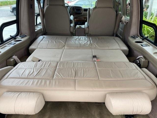 2002 Summit White /Neutral Chevrolet Express Van HI TOP EXPLORER CONV (1GBFG15R321) with an 5.7L Vortec 5700 SFI V8 Gas Engine engine, Automatic transmission, located at 4701 North Dixie Hwy, Pompano Beach, FL, 33064, (954) 422-2889, 26.240938, -80.123474 - OUR WEBPAGE FLORIDACARS1.COM HAS OVER 100 PHOTOS AND FREE CARFAX LINK 2002 Chevrolet Express G1500 Van 5.7L V8 F OHV Gasoline 17 MPG Rear Wheel Drive Features ABS Brakes Air Conditioning AM/FM Stereo Automatic Transmission Cassette Player CD Audio Power Locks Power Mirrors Power Seat(s) Power Window- Photo#84