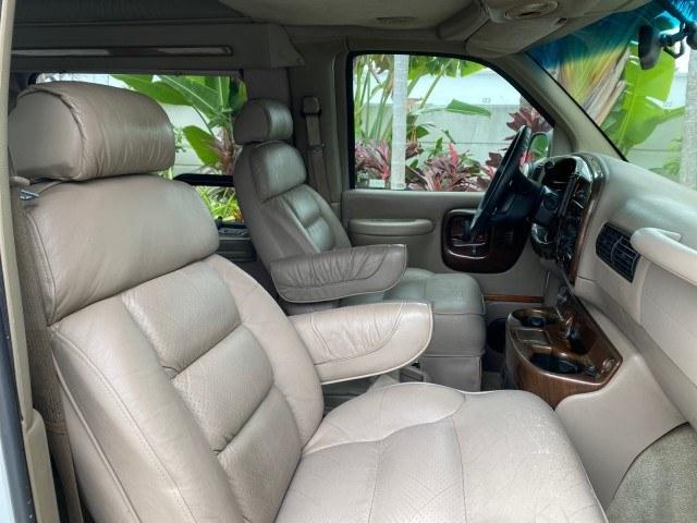 2002 Summit White /Neutral Chevrolet Express Van HI TOP EXPLORER CONV (1GBFG15R321) with an 5.7L Vortec 5700 SFI V8 Gas Engine engine, Automatic transmission, located at 4701 North Dixie Hwy, Pompano Beach, FL, 33064, (954) 422-2889, 26.240938, -80.123474 - OUR WEBPAGE FLORIDACARS1.COM HAS OVER 100 PHOTOS AND FREE CARFAX LINK 2002 Chevrolet Express G1500 Van 5.7L V8 F OHV Gasoline 17 MPG Rear Wheel Drive Features ABS Brakes Air Conditioning AM/FM Stereo Automatic Transmission Cassette Player CD Audio Power Locks Power Mirrors Power Seat(s) Power Window- Photo#94