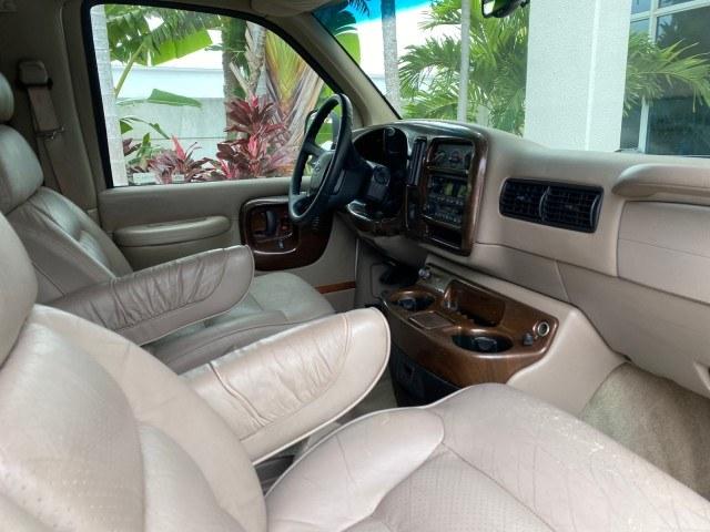 2002 Summit White /Neutral Chevrolet Express Van HI TOP EXPLORER CONV (1GBFG15R321) with an 5.7L Vortec 5700 SFI V8 Gas Engine engine, Automatic transmission, located at 4701 North Dixie Hwy, Pompano Beach, FL, 33064, (954) 422-2889, 26.240938, -80.123474 - OUR WEBPAGE FLORIDACARS1.COM HAS OVER 100 PHOTOS AND FREE CARFAX LINK 2002 Chevrolet Express G1500 Van 5.7L V8 F OHV Gasoline 17 MPG Rear Wheel Drive Features ABS Brakes Air Conditioning AM/FM Stereo Automatic Transmission Cassette Player CD Audio Power Locks Power Mirrors Power Seat(s) Power Window- Photo#96
