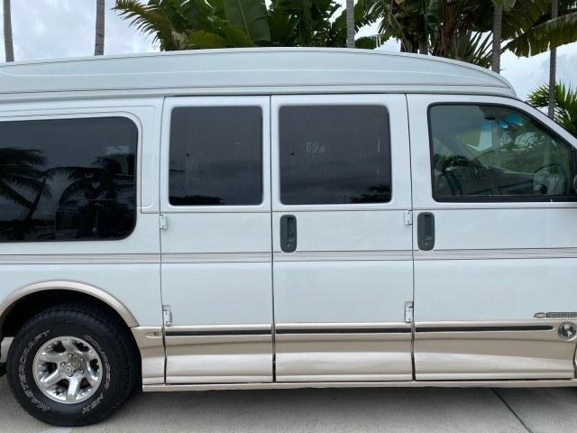 2002 Summit White /Neutral Chevrolet Express Van HI TOP EXPLORER CONV (1GBFG15R321) with an 5.7L Vortec 5700 SFI V8 Gas Engine engine, Automatic transmission, located at 4701 North Dixie Hwy, Pompano Beach, FL, 33064, (954) 422-2889, 26.240938, -80.123474 - OUR WEBPAGE FLORIDACARS1.COM HAS OVER 100 PHOTOS AND FREE CARFAX LINK 2002 Chevrolet Express G1500 Van 5.7L V8 F OHV Gasoline 17 MPG Rear Wheel Drive Features ABS Brakes Air Conditioning AM/FM Stereo Automatic Transmission Cassette Player CD Audio Power Locks Power Mirrors Power Seat(s) Power Window- Photo#98