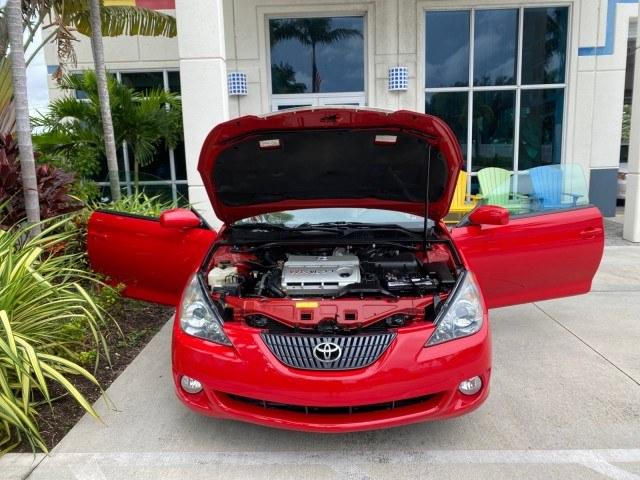 2006 Absolutely Red /Ivory Toyota Camry Solara SLE V6 LOW MILES 82,218 1 OWNER (4T1FA38P16U) with an 3.3L DOHC SMPI 24-Valve V6 Engine engine, Automatic transmission, located at 4701 North Dixie Hwy, Pompano Beach, FL, 33064, (954) 422-2889, 26.240938, -80.123474 - OUR WEBPAGE FLORIDACARS1.COM HAS OVER 100 PHOTOS AND FREE CARFAX LINK 2006 Toyota Camry Solara SLE V6 1 OWNER Convertible 3.3L V6 F DOHC 24V Gasoline 29 MPG Front Wheel Drive Features ABS Brakes Air Conditioning Alloy Wheels AM/FM Stereo Automatic Transmission CD Audio Cruise Control Front Seat Heat- Photo#16