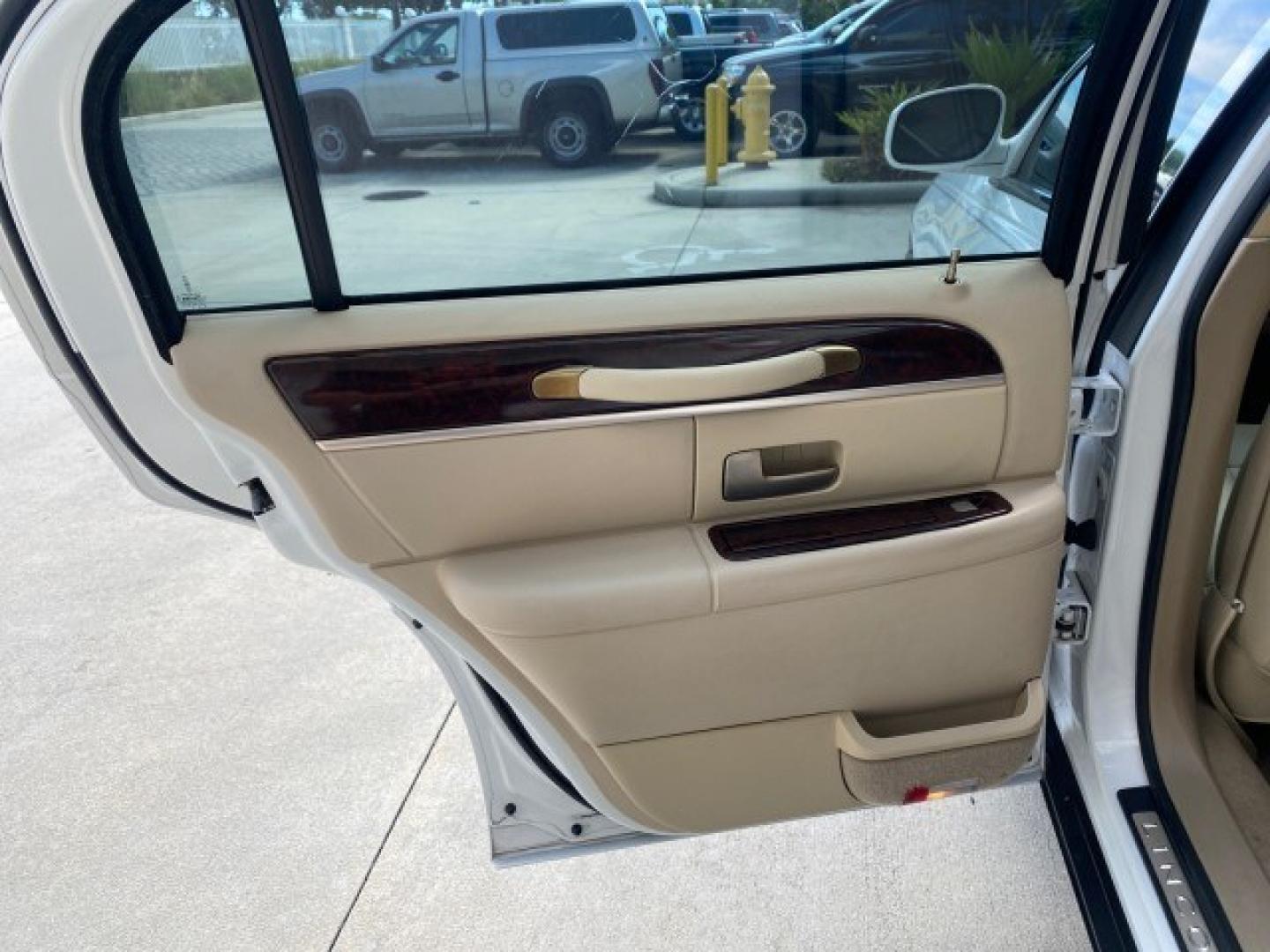 2011 Vibrant White /Light Camel Lincoln Town Car Signature Limited 1 OWNER (2LNBL8CVXBX) with an 4.6L SOHC EFI V8 FFV Engine engine, Automatic transmission, located at 4701 North Dixie Hwy, Pompano Beach, FL, 33064, (954) 422-2889, 26.240938, -80.123474 - OUR WEBPAGE FLORIDACARS1.COM HAS OVER 100 PHOTOS AND FREE CARFAX LINK 2011 Lincoln Town Car Signature Limited Sedan 4 DR 4.6L V8 F SOHC 16V Flex Fuel 24 MPG Rear Wheel Drive Features ABS Brakes Air Conditioning Alloy Wheels AM/FM Stereo Automatic Transmission CD Audio Cruise Control Flex Fuel Vehicl- Photo#53