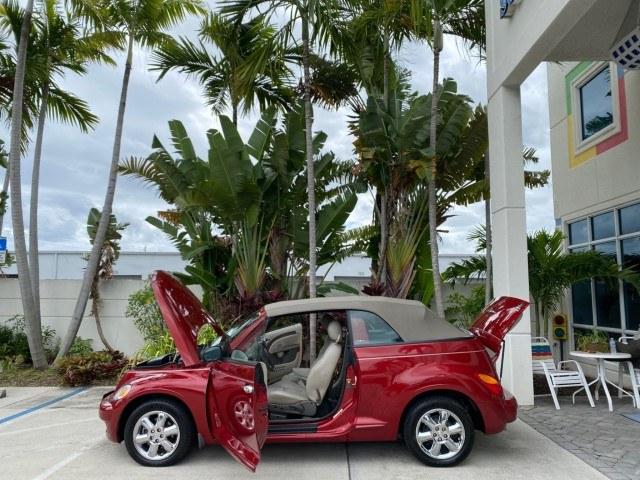 2005 Inferno Red Crystal Pearl /Taupe/Pearl Beige Chrysler PT Cruiser Touring CONV LOW MILES 34,462 (3C3AY55E85T) with an 2.4L DOHC SMPI 16-Valve I4 Engine engine, Automatic transmission, located at 4701 North Dixie Hwy, Pompano Beach, FL, 33064, (954) 422-2889, 26.240938, -80.123474 - OUR WEBPAGE FLORIDACARS1.COM HAS OVER 100 PHOTOS AND FREE CARFAX LINK 2005 Chrysler PT Cruiser Touring Convertible 2.4L I4 F DOHC 16V Gasoline 29 MPG Front Wheel Drive Features ABS Brakes Air Conditioning Alloy Wheels AM/FM Stereo Automatic Transmission Cassette Player CD Audio Cruise Control Leathe- Photo#8