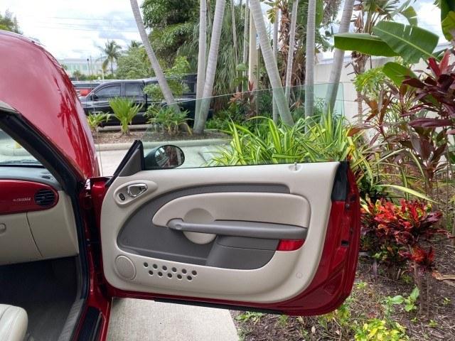 2005 Inferno Red Crystal Pearl /Taupe/Pearl Beige Chrysler PT Cruiser Touring CONV LOW MILES 34,462 (3C3AY55E85T) with an 2.4L DOHC SMPI 16-Valve I4 Engine engine, Automatic transmission, located at 4701 North Dixie Hwy, Pompano Beach, FL, 33064, (954) 422-2889, 26.240938, -80.123474 - OUR WEBPAGE FLORIDACARS1.COM HAS OVER 100 PHOTOS AND FREE CARFAX LINK 2005 Chrysler PT Cruiser Touring Convertible 2.4L I4 F DOHC 16V Gasoline 29 MPG Front Wheel Drive Features ABS Brakes Air Conditioning Alloy Wheels AM/FM Stereo Automatic Transmission Cassette Player CD Audio Cruise Control Leathe- Photo#11