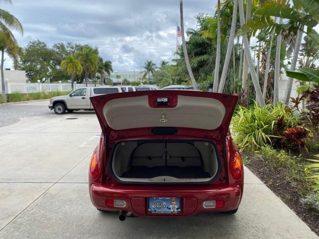 2005 Inferno Red Crystal Pearl /Taupe/Pearl Beige Chrysler PT Cruiser Touring CONV LOW MILES 34,462 (3C3AY55E85T) with an 2.4L DOHC SMPI 16-Valve I4 Engine engine, Automatic transmission, located at 4701 North Dixie Hwy, Pompano Beach, FL, 33064, (954) 422-2889, 26.240938, -80.123474 - OUR WEBPAGE FLORIDACARS1.COM HAS OVER 100 PHOTOS AND FREE CARFAX LINK 2005 Chrysler PT Cruiser Touring Convertible 2.4L I4 F DOHC 16V Gasoline 29 MPG Front Wheel Drive Features ABS Brakes Air Conditioning Alloy Wheels AM/FM Stereo Automatic Transmission Cassette Player CD Audio Cruise Control Leathe- Photo#59