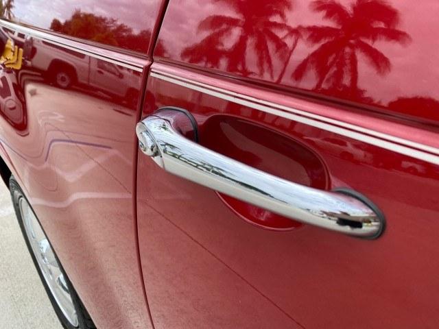 2005 Inferno Red Crystal Pearl /Taupe/Pearl Beige Chrysler PT Cruiser Touring CONV LOW MILES 34,462 (3C3AY55E85T) with an 2.4L DOHC SMPI 16-Valve I4 Engine engine, Automatic transmission, located at 4701 North Dixie Hwy, Pompano Beach, FL, 33064, (954) 422-2889, 26.240938, -80.123474 - OUR WEBPAGE FLORIDACARS1.COM HAS OVER 100 PHOTOS AND FREE CARFAX LINK 2005 Chrysler PT Cruiser Touring Convertible 2.4L I4 F DOHC 16V Gasoline 29 MPG Front Wheel Drive Features ABS Brakes Air Conditioning Alloy Wheels AM/FM Stereo Automatic Transmission Cassette Player CD Audio Cruise Control Leathe- Photo#65