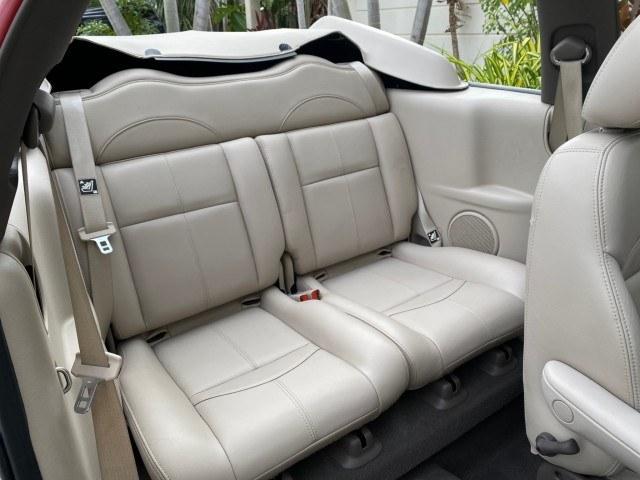 2005 Inferno Red Crystal Pearl /Taupe/Pearl Beige Chrysler PT Cruiser Touring CONV LOW MILES 34,462 (3C3AY55E85T) with an 2.4L DOHC SMPI 16-Valve I4 Engine engine, Automatic transmission, located at 4701 North Dixie Hwy, Pompano Beach, FL, 33064, (954) 422-2889, 26.240938, -80.123474 - OUR WEBPAGE FLORIDACARS1.COM HAS OVER 100 PHOTOS AND FREE CARFAX LINK 2005 Chrysler PT Cruiser Touring Convertible 2.4L I4 F DOHC 16V Gasoline 29 MPG Front Wheel Drive Features ABS Brakes Air Conditioning Alloy Wheels AM/FM Stereo Automatic Transmission Cassette Player CD Audio Cruise Control Leathe- Photo#77